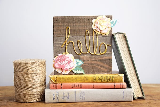 Make a welcome sign using hot glue and a wood pallet