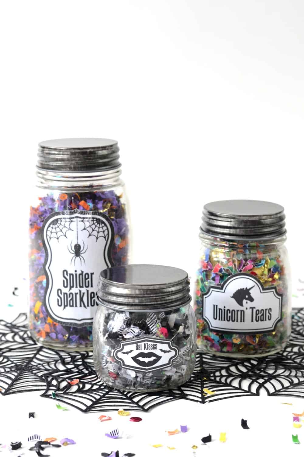 Confetti jars that glow in the dark make a perfect party favor for a Halloween celebration. Because who doesn't love confetti?! Get a free printable too!