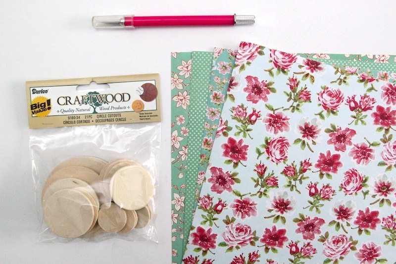 Wood circles scrapbook paper and a craft knife